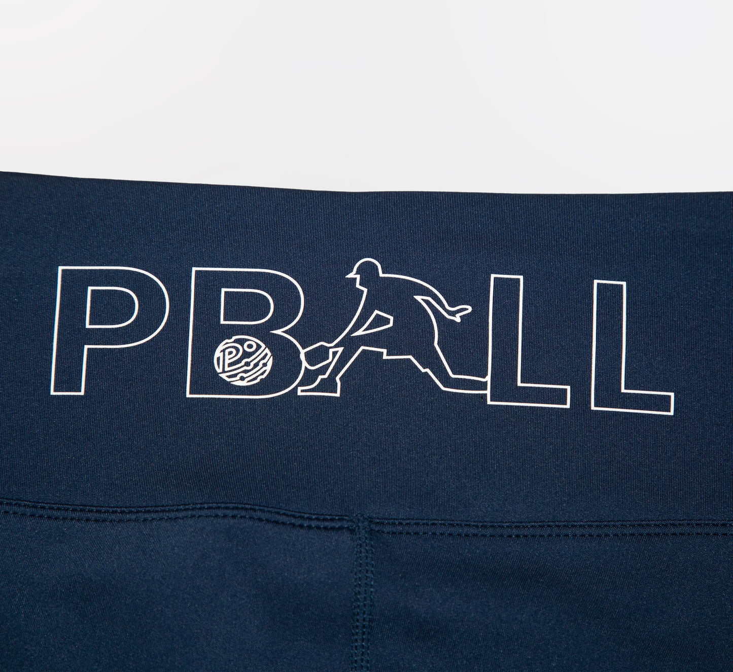 Navy blue biker shorts with white PBALL logo on a white background