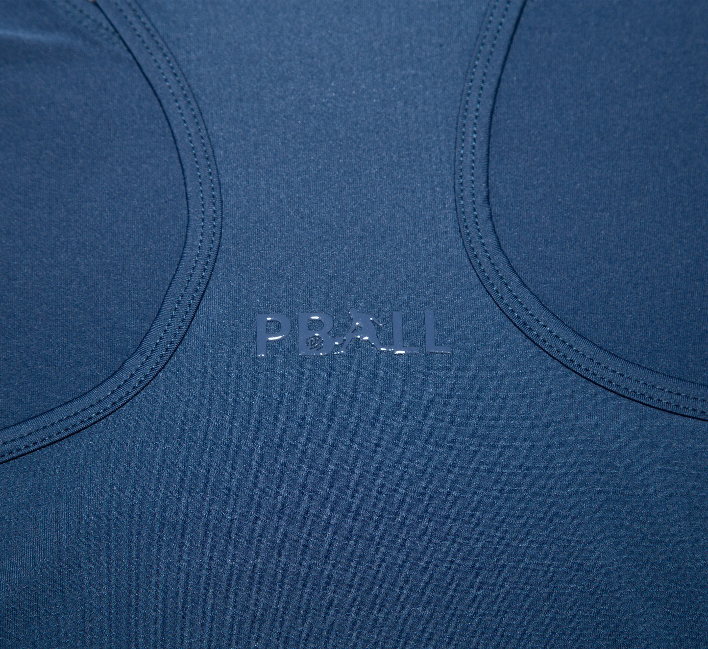 Close-up of a Blue tank top with PBALL branding Bleu