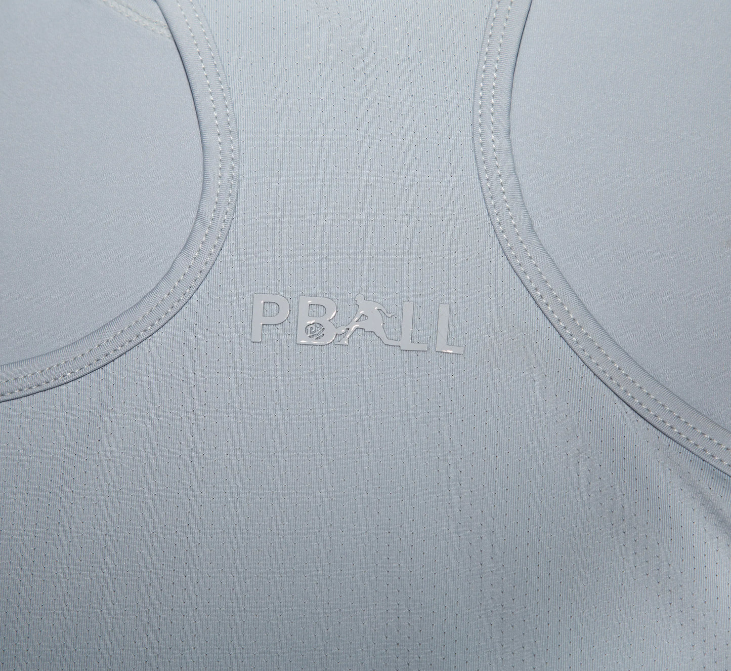 Light Grey fabric with PBALL logo on a close-up of a garment Gris
