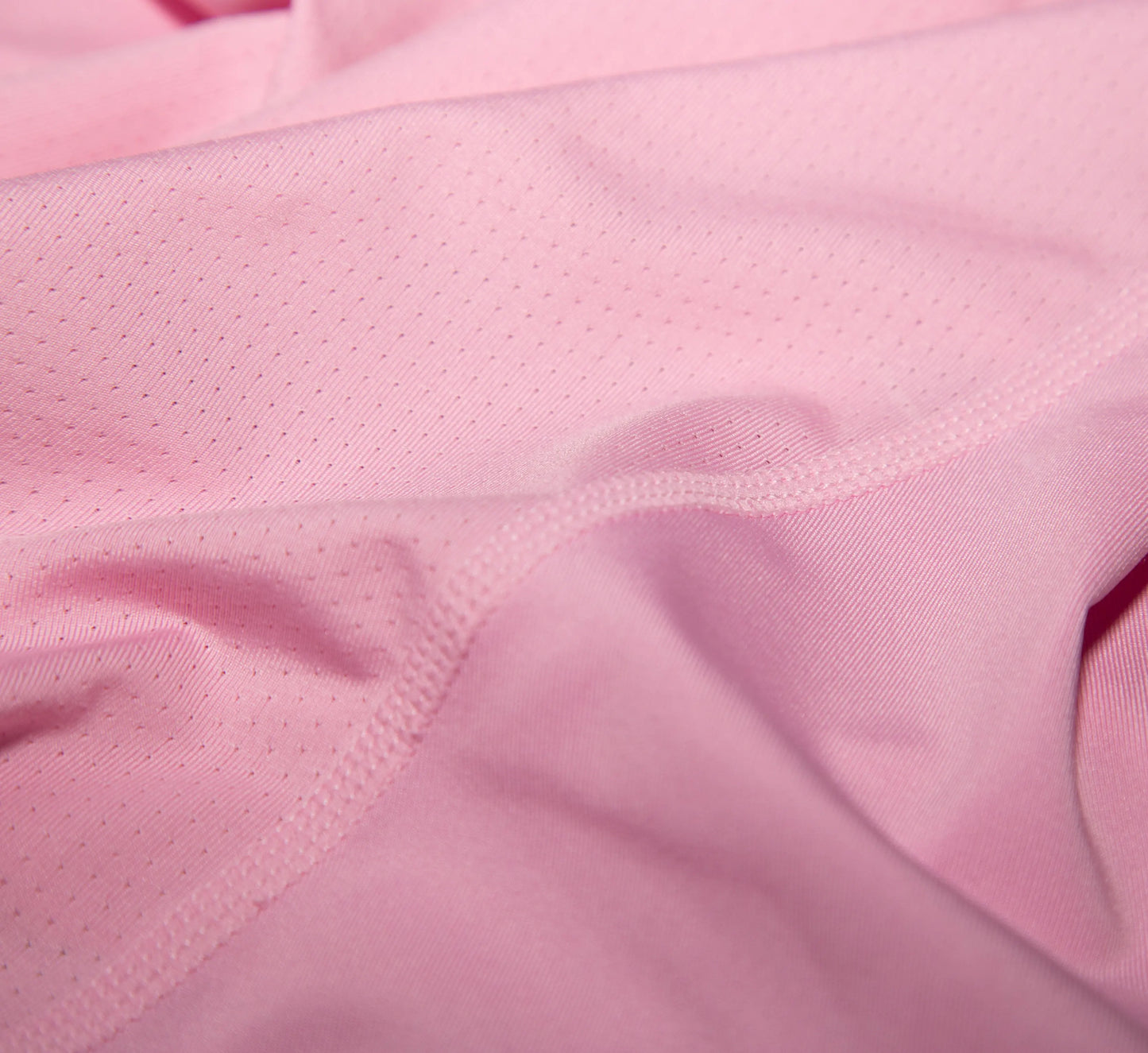 Close-up of Pink tank top fabric with a textured pattern Rose