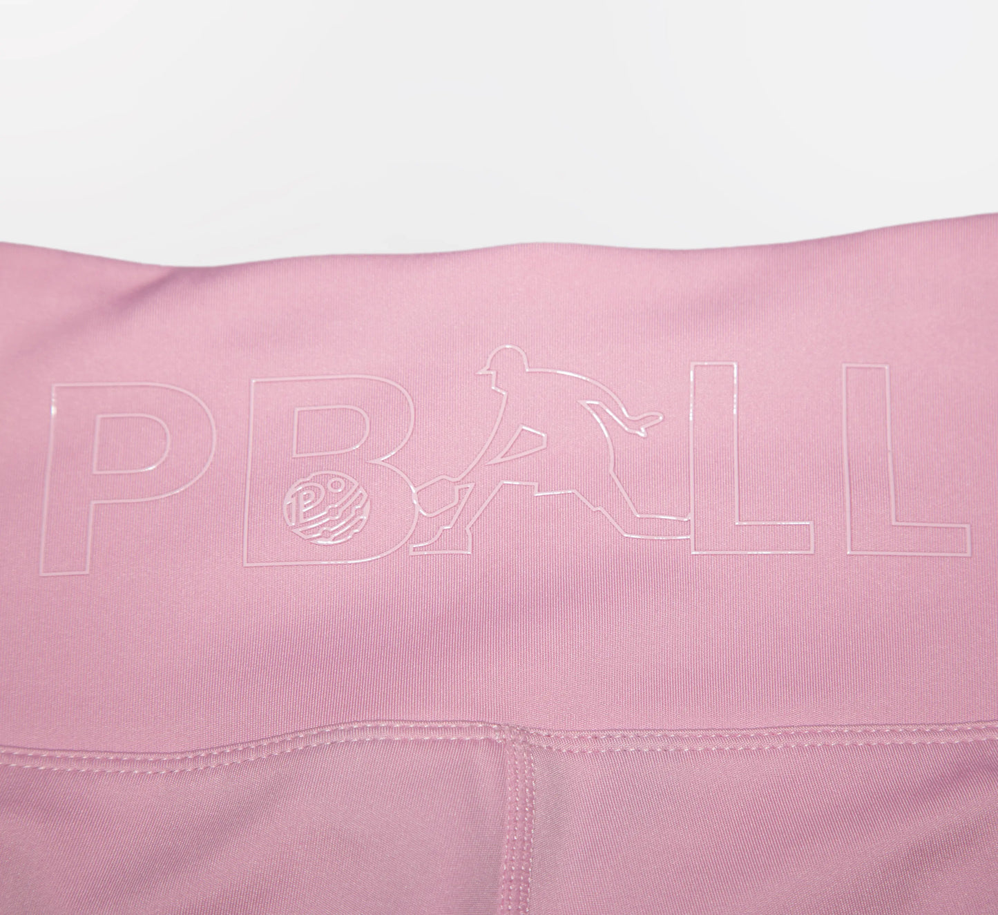 Pink fabric with PBALL logo on a white background