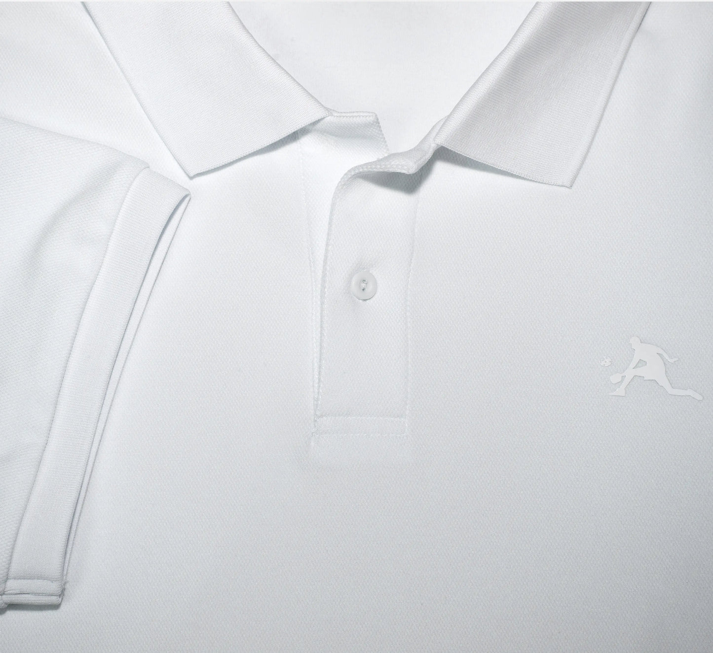 Close-up of a White polo shirt with a small PBALL logo on a light gray background Blanc