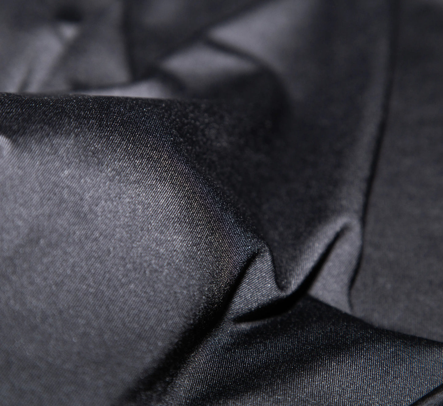 Gros plan sur un tissu de t-shirt Noir avec plis. Black