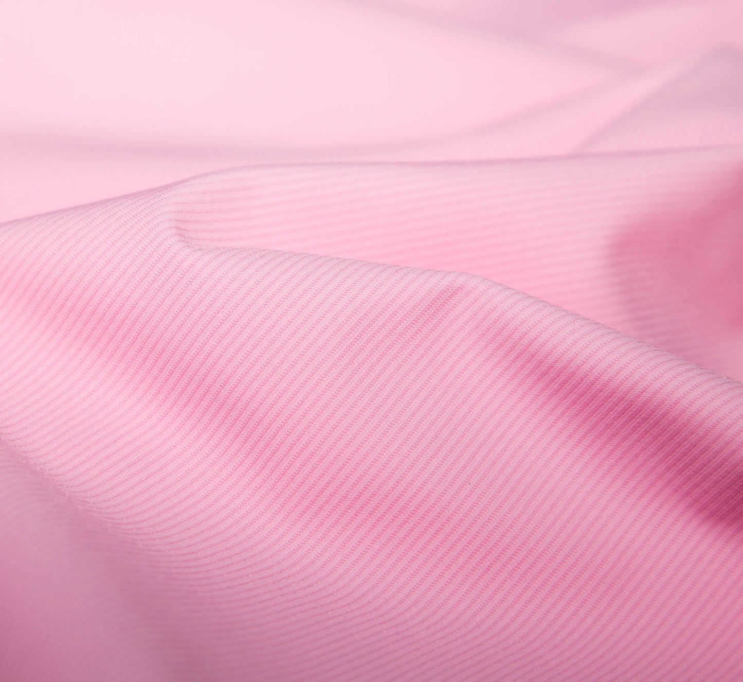 Close-up of Pink fabric with a subtle texture Rose