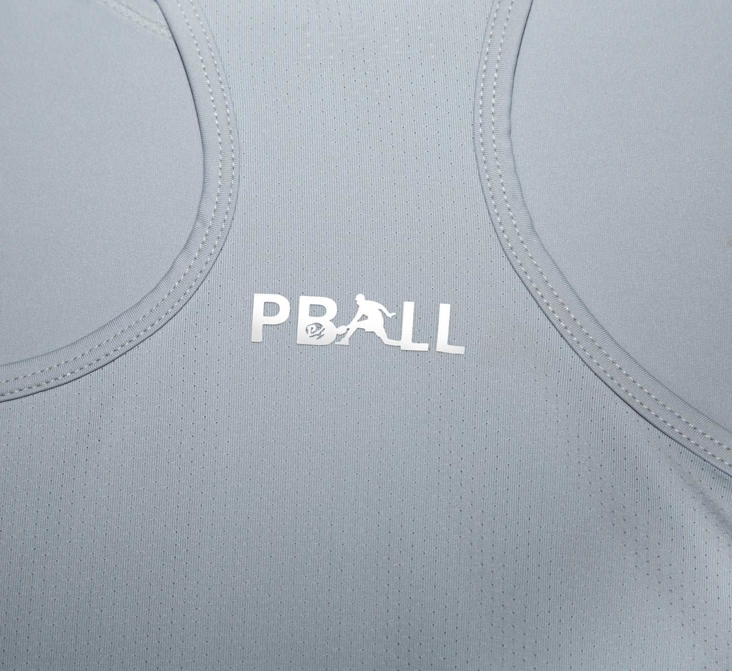 Grey athletic tank top with PBALL logo on a close-up of fabric texture Gris