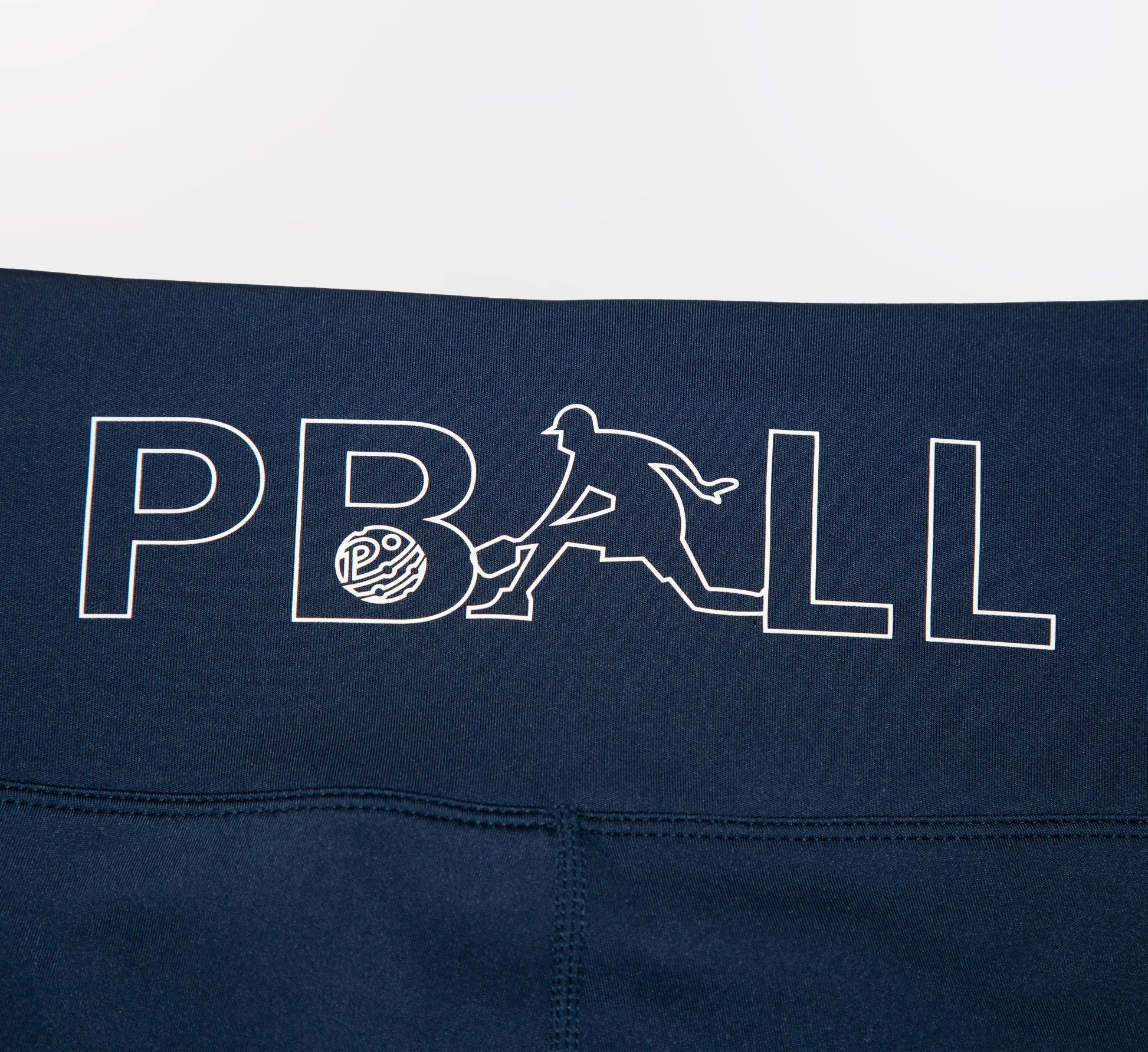 Navy blue biker shorts with white PBALL logo on a white background