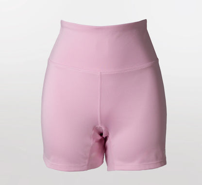 Pink biker shorts on a light gray background
