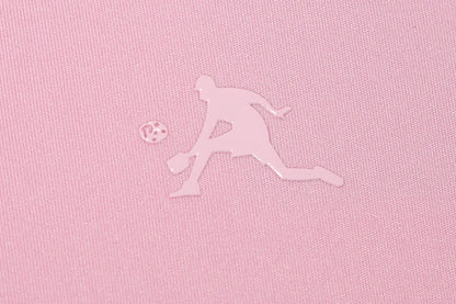 Silhouette of a pickleball player and ball on pink fabric