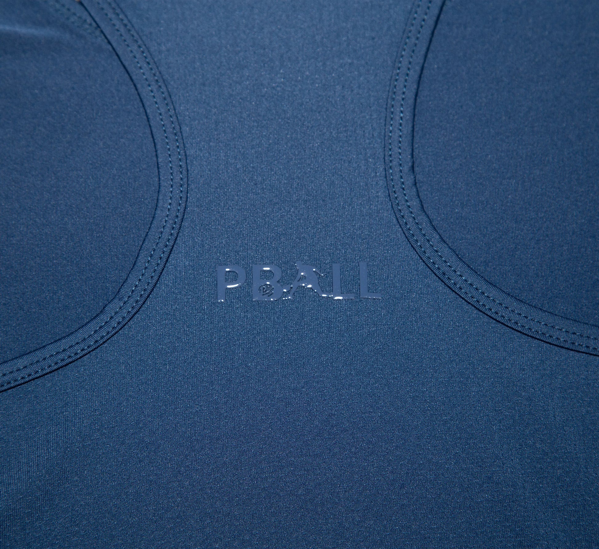 Close-up of a Blue tank top with PBALL branding Bleu