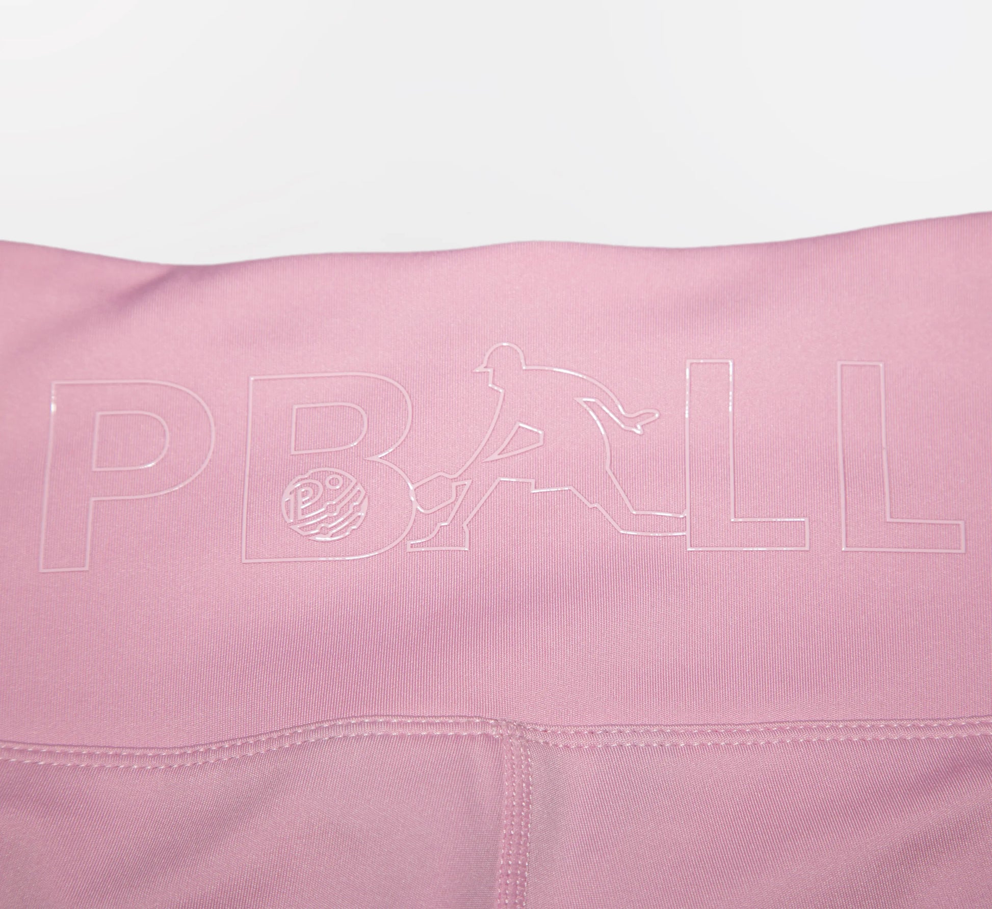 Pink fabric with PBALL logo on a white background