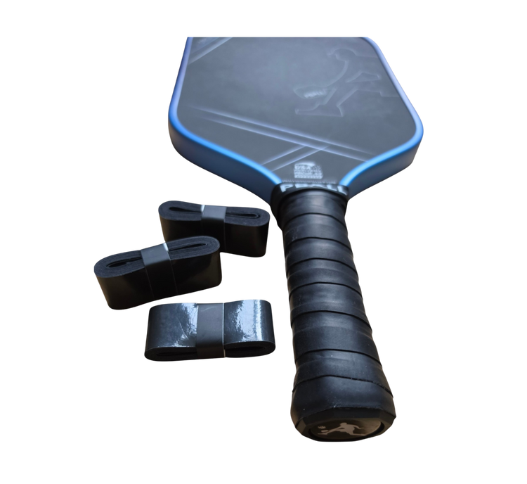 A PBALL pickleball paddle with a black and blue face, black wrapped handle grip, and three black overgrows, shown on a plain white background.