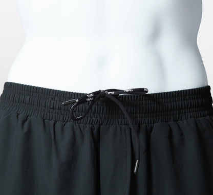 Black athletic shorts with drawstring on a white background Noir