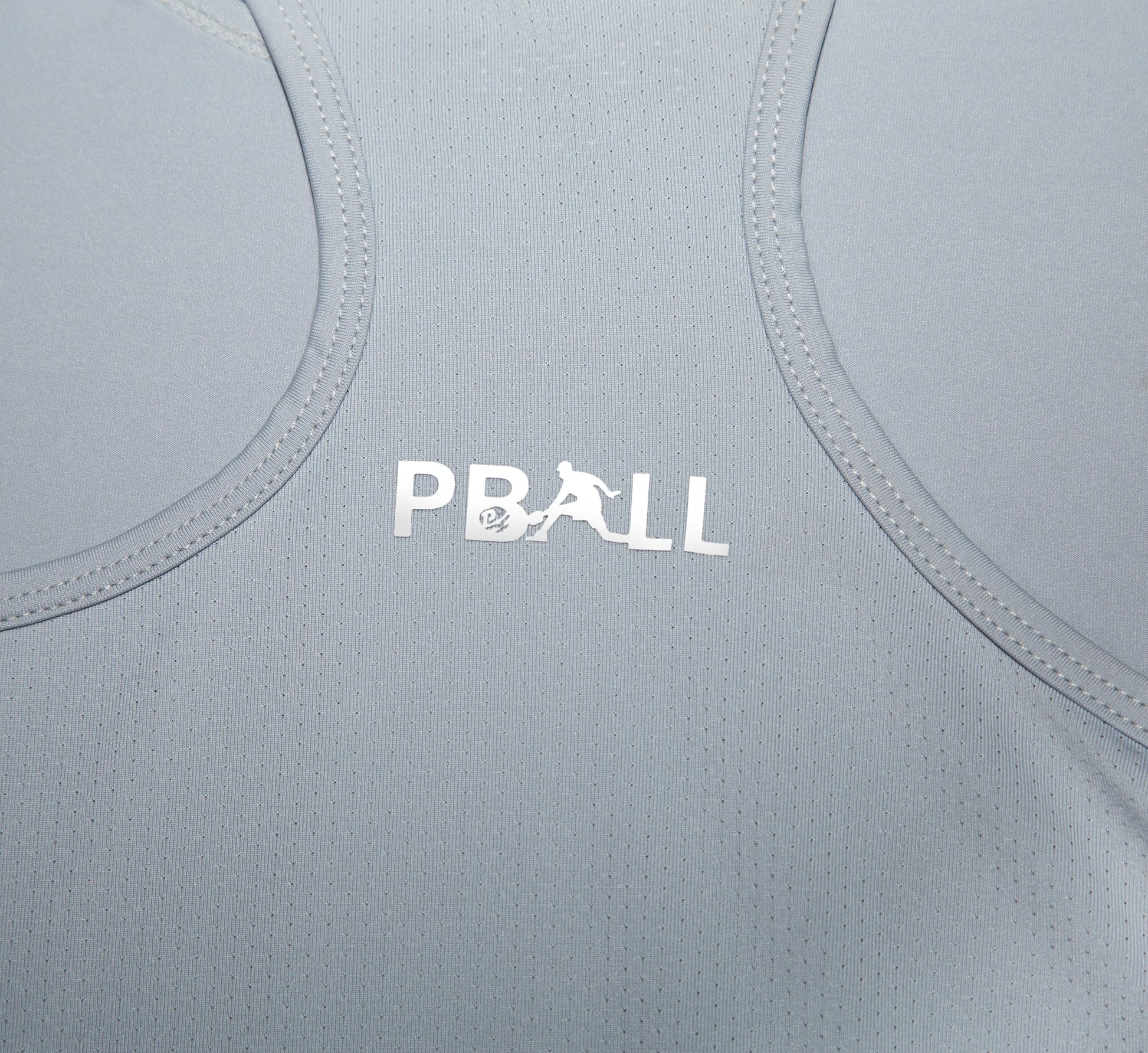 Grey athletic tank top with PBALL logo on a close-up of fabric texture Gris